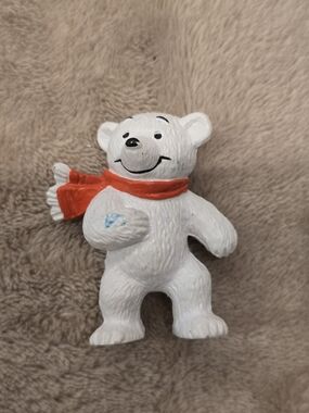 Vintage Bullyland PVC figurine of a polar bear wearing a red scarf